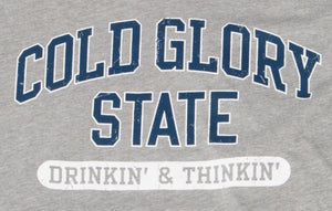 Close-up of grey and blue Collegiate Varsity T-shirt. Distressed printing of college or university  name and Drinking and Thinking sport.