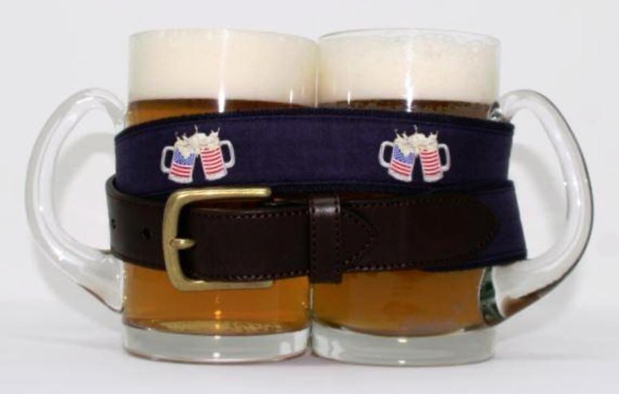 Preppy patriotic beer mugs with american flags drinking belt, with brass buckle similar to Vineyard Vines, wrapped around 2 full glass beer mugs.